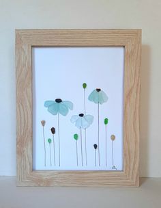 a wooden frame with flowers painted on it