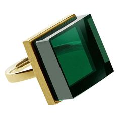 This ring is made of yellow gold-plated sterling silver and features a 15x15x8 mm green grown quartz, size 17. It was featured in Harper's Bazaar and Vogue UA. Reflecting the art deco spirit, this ring is versatile enough to be worn by both women and men. It inspires architects, designers, and artists alike. The gemstone has an unusual cut that catches the light, drawing attention to its striking green color. As a larger ring, it makes a bold statement. This ring can serve as the centerpiece of a jewelry collection, pairing well with both everyday black dresses and more formal evening wear. Created by an artist, this ring symbolizes frozen ink and can be ordered in 14 or 18 karat white, rose, or yellow gold. Be sure to contact the artist to specify the ring size. Luxury Modernist Rings With Unique Design, Gold Rings Fashion, Contemporary Ring, Big Rings, Gold Art Deco, Estilo Art Deco, Green Quartz, Deco Jewelry, Gold Art