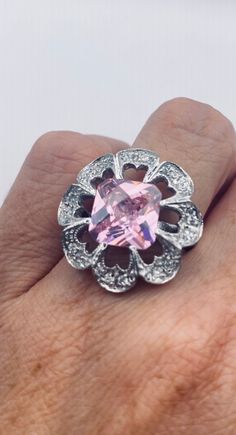 Unusual pale pink ice CZ Deco sterling setting handmade  Size 7 Can be resized. My jeweler charges $20 All rings are shipped in a nice gift box.   Check out our over a THOUSAND great reviews Engraving is $4 per letter and is not always perfect depending on the piece. It can take a few days if the jeweler is busy. This is payable to Paypal Judithsltd@gmail.com Pink Sterling Silver Crystal Ring With Gem, Handmade Pink Ring In Fine Jewelry Style, Handmade Pink Rings In Fine Jewelry Style, Handmade Pink Fine Jewelry Ring, Pink Sterling Silver Crystal Ring, Pink Sterling Silver Crystal Ring With Center Stone, Fine Jewelry Pink Stone Setting Jewelry, Sterling Silver Jewelry With Pink Center Stone, Pink Sterling Silver Jewelry With Center Stone