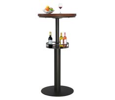 a table with two wine glasses and bottles on it next to a bowl of fruit