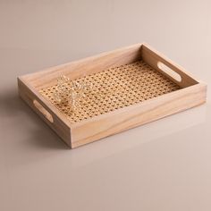 a wooden tray with some glass items in it