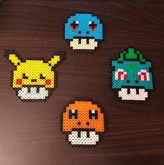 four perler beads are arranged in the shape of pikachu and eebi