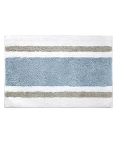 a blue and gray striped rug on a white background