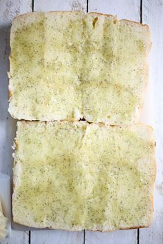 two slices of garlic bread on a cutting board