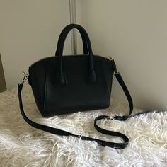 Nwot Chic Black Handbag Crafted With Vegan Leather With Three Inside Compartments. Bold Zipper Closure. Detachable Shoulder Strap. Classic Black Handheld Satchel, Evening Black Shoulder Bag With Zipper Closure, Classic Black Faux Leather Shoulder Bag, Chic Black Satchel Shoulder Bag, Chic Black Satchel As Shoulder Bag, Black Formal Shoulder Bag With Zipper, Chic Black Satchel With Removable Pouch, Classic Black Shoulder Bag With Zipper, Chic Black Crossbody Satchel