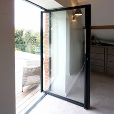 an empty room with sliding glass doors leading outside