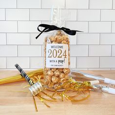 a bag of popcorn sitting on top of a table next to scissors and other items