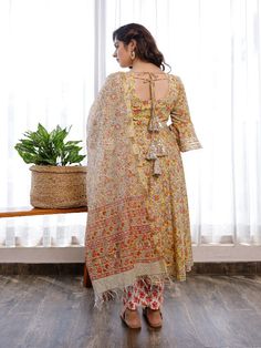 This gorgeous suit set, which includes pants and a chanderi hand block printed chanderi dupatta, is a must-have in your summer wardrobe. It has a flowery round neck hand block printed Anarkali with flared sleeves embellished with Gota. Neck: Boat Neck Sleeve Length: 3/4th Flared Sleeves Kurta Length: Claf Length Fabric: Kurta & Bottom - Cotton Dupatta -Chanderi Note: Wash Care Instructions - Dry Clean Only. The product will be shipped within 15-20 days of the order placed Measurements: Size Bust Festive Cotton Palazzo Set With Sheer Dupatta, Cotton Sharara With Sheer Dupatta For Festivals, Block Print Mulmul Sharara With Straight Kurta, Designer Cotton Palazzo Set With Sheer Dupatta, Anarkali Lawn Suit With Block Print, Traditional Anarkali Set With Kalamkari Print, Chanderi Sharara With Block Print Straight Kurta, Bollywood Style Chanderi Sharara With Block Print, Cotton Salwar Kameez With Sheer Dupatta For Navratri