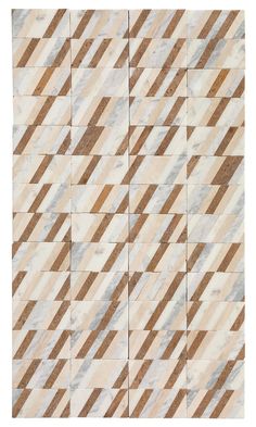 a white and brown tile with diagonal stripes