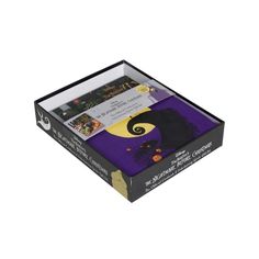 an open box with halloween themed items inside