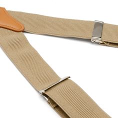 Look to tradition to create a modern, yet sophisticated style. Our Tan Clip Suspenders are designed to provide support without sacrificing comfort. The expert craftsmanship of our leather crosspatch suspenders do not restrict movement and will remain in place without slipping or having to adjust. Suspenders add a unique and versatile look that can be dressed up with a suit, or dressed down with jeans and a blazer. Classic Formal Adjustable Belts And Suspenders, Elegant Adjustable Belts And Suspenders For Work, Classic Adjustable Belts And Suspenders For Work, Adjustable Belts And Suspenders For Workwear, Elegant Business Belts And Suspenders With Adjustable Strap, Elegant Belts And Suspenders With Adjustable Straps For Business, Elegant Adjustable Straps Belts And Suspenders For Business, Classic Formal Belts And Suspenders With Adjustable Strap, Classic Belts And Suspenders With Adjustable Strap For Everyday