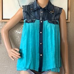 This Cute Partial Demon, Partial Silk/Polyester Sleeveless Button Down Shirt Was Bought At A Boutique And Never Worn. Size Large. See Photos For Measurements. Blue Button-up Vest With Buttons, Blue Button-up Denim Vest, Button-up Blue Denim Vest, Button-up Blue Denim Vest With Buttons, Blue Button-up Vest With Button Closure, Blue Buttoned Blouse For Summer, Sleeveless Tops With Snap Buttons For Spring, Sleeveless Spring Tops With Snap Buttons, Summer Blue Blouse With Buttons