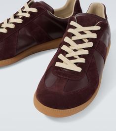 Find MAISON MARGIELA Replica Leather And Suede Sneakers on Editorialist. Upper: leather. Lining: fabric. Sole: leather insole, rubber sole. Toe shape: round toe. Made in Italy. Includes: shoe box. Designer color name: Deep Red. Trim: suede. Closure: lace-up. Round Toe Sneakers, Capsule Closet, Round Toe Shoes, Red Sneakers, Brown Sneakers