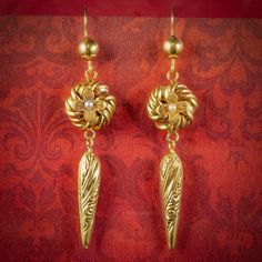 These beautiful Antique Victorian drop earrings have been modelled in 15ct Yellow Gold with a fabulous, engraved icicle shaped dropper below and a Lover’s Knot in the centre topped with a Pearl. Antiques Atlas #antiqueearings #antiquejewellery #pearlearring Lovers Knot, Love Knot, Vintage Jewels, Fine Earrings, Love Symbols, Antique Jewellery