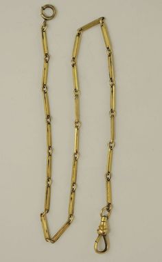 This is vintage gold plated watch chain. The chain is made up of a single length of alternating parallel curb links and carved solid longer links. The chain measures 360mm in length from the dog clip at one end to the bolt ring at the other. The longer links measures 2.5mm wide The chain is in 90% mint condition - some loss of gilding but still an excellent chain Gold Plated Watch, Bolt Ring, Vintage Pocket Watch, Dog Clip, Pocket Watch Chain, Watch Chain, Vintage Watches, The Dog, Pocket Watch