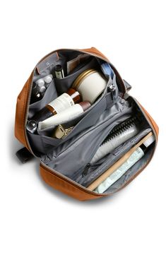 an open toiletry bag filled with personal items