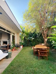 an outdoor living area with furniture and trees