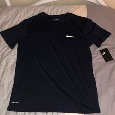 Brand New Navy Sporty Crew Neck Shirt, Navy Sporty Shirt With Crew Neck, Sporty Navy Shirt With Crew Neck, Navy Moisture-wicking Short Sleeve Top, Nike Navy T-shirt With Graphic Print, Nike Navy T-shirt For Sports, Nike Navy Sports T-shirt, Nike Sports T-shirt In Navy, Nike Navy Sports Tops