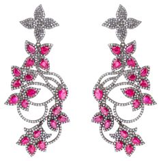 Experience the epitome of luxury with our 12 Carat Diamond and Ruby Fashion Earrings. Each piece is uniquely crafted and meticulously curated, embodying a perfect blend of elegance and contemporary design that enhances any jewelry collection. At the center of these stunning earrings are dazzling 12-carat diamonds, selected for their exceptional clarity and brilliance. Each diamond is expertly cut to maximize its natural sparkle, ensuring a captivating display of light with every movement. Comple Luxury Hand Set Drop Bridal Earrings, Luxury Bridal Drop Earrings Hand Set, Luxury Hand-set Drop Bridal Earrings, Luxury Hand Set Cubic Zirconia Earrings, Luxury Cubic Zirconia Earrings Hand Set, Luxury Drop Earrings Bridal With Elegant Design, Luxury Drop Earrings With Elegant Design, Luxury Drop Earrings With Elegant Design For Bridal, Luxury Drop Bridal Earrings With Elegant Design