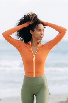 Styling tip: pair our new one-piece swimsuits with our leggings for full body coverage so that you’re free to stay in the sun all day without worry! Long Sleeve Beachwear Swimwear For Outdoors, Long Sleeve Beachwear For Outdoor, Long Sleeve Athleisure Swimwear With Upf 50+, Long Sleeve Upf 50+ Swimwear For Athleisure, High Stretch Long Sleeve Athleisure Swimwear, Long Sleeve Swimwear With Upf 50+ For Outdoor, Long Sleeve Stretch Athleisure Swimwear, Athleisure Long Sleeve Stretch Swimwear, Sporty Long Sleeve Swimwear For Outdoor