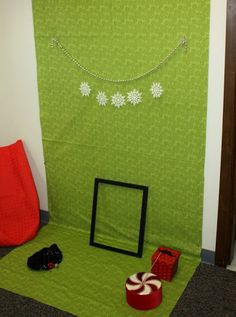 a room with green walls and decorations on the floor