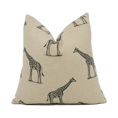 a pillow with giraffes on it