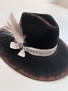 "100% Wool : Handmade Hat : Each hat is hand-designed by me. These are made per order. 5-7 Business Day Processing time. Each hat may have slight differences. One Size fits all adjust hat. Without adjustments, hat measures at 7 1/4. Brim 4.75\" Crown height 4.75\" Sweat band can be adjusted to fit smaller size. For any questions, please reach out :) RETURN POLICY: Hats that are customized will NOT be eligible for returns as these hats are made specifically to your liking. For hats that don't have any extra customizations added; hats with a design that I already sell, and nothing added and or changed to them: I offer returns for 50% refund as these hats are made per order. IF hat shows any signs of wear, hat will NOT be eligible for a refund. However, If you do have any problems with your o Custom Cowboy Hats, Lainey Wilson, Handmade Hats, Sweat Band, Mount Washington, Boho Hat, Western Hats, Wool Handmade, Handmade Hat