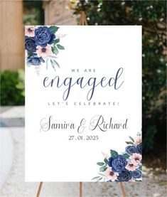 a sign that says we are engaged with blue flowers on it and the words, let's celebrate