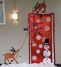 an image of a door decorated with christmas decorations and snowman on pinterest