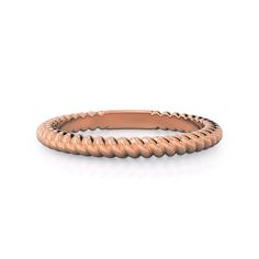 an 18k rose gold wedding band with twisted rope design on the side, set against a white background