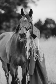 black and white photograph of a woman with a horse