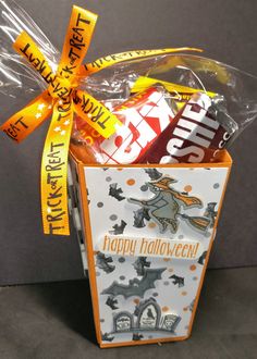 a halloween treat basket with candy and candies