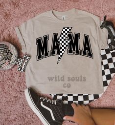 Checkered Mama Lightning Bolt Tee | Comfort Colors | Mom | Racetrack | Trendy | Checkerboard Shirt | Skateboard | Gifts for Her | Graphic This DTF screen print checkered lightning bolt MAMA shirt is going to be your new favorite shirt! It is super comfy and a perfect staple for your closet! Our shirts are super soft and we use quality transfers.  Comfort Colors: - Unisex Sizing - Size down for smaller fit & up for larger fit - 100% ring-spun cotton Shirt colors may vary slightly.  SHIRT CARE: - Mama Shirt Ideas, Checkerboard Shirt, Cute Mom Shirts, Fair Girls, Skateboarder Gifts, Diy Shirts, Girl Shirts, Trendy Shirt Designs, Shirt Prints