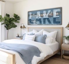 a bedroom with white walls and blue accents