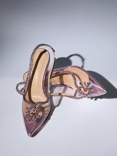 Make a glamorous entrance in the Crystal Cutout Embellished Pumps In Pink. They're made from pink PVC and edged with crystal-encrusted leather trims that form alluring cutouts at the vamps. Approx 8.5 cm / 3.3 inch heel Pointed toe Formal Heels With Rhinestone Rivets, Luxury Crystal-embellished Heels For Prom, Glamorous Pink Heels For Party, Pink Glamorous Heels For Night Out, Glamorous Pink Heels For Night Out, Pink Rhinestone Pointed Toe Heels, Chic Pink Heels With Rhinestones, Glamorous Pink Pointed Toe Heels, Elegant Evening Heels With Rhinestone Rivets