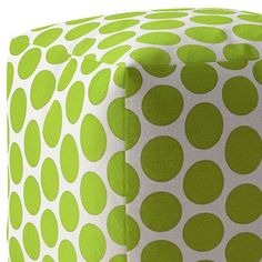 a green and white polka dot pouff