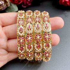 Set of 4 jadau bangles made in 22ct gold, design borrowed from the mughal times. It has been embellished with rubies, emeralds and pearls. Weight of the bangles in a set of four is 84.85 GMs. A timeless and precious addition to any jewelry collection, the set of four bangles is a perfect reminder of the effortless luxury of traditional India. Handcrafted with intricate detail, each bangle is a charming reminder of the culture's exquisite craftsmanship. Price Breakup Summary Component Rupees % of Traditional Ruby Bangle For Festive Occasions, Traditional Ruby Bangle With Stone Work, Traditional Ruby Bangle, Traditional Yellow Gold Bangle With Stone Work, Jadau Bangles, 22k Gold Jewelry Necklaces, Indian Customs, 22k Gold Jewelry, The Bangles