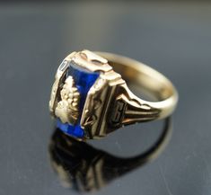 This is the perfect option for those who like cool, unique jewelry and the luxury, shine of gold, blue. This ring is well made, cute and/or elegant in design, and very desirable. Vintage ring decorated with the blue stone in the center and signed A -1955-6 The ring has a hallmark, 10k Josten. Its weight is 4.9 grams and is a size 6 3/4. In good condition. Every one interested in the jewelry should remember that he or she must like their jewelry- not just at first sight.... but for always. To hav Formal Blue Signet Ring, Formal Blue Signet Ring Stamped 14k, Formal Blue Hallmarked Signet Ring, Blue Birthstone Ring Stamped 14k As Gift, Blue 14k Gold Rings For Anniversary, Formal Blue 14k Gold Signet Ring, Blue 14k Gold Ring Stamped 14k, Blue 14k Stamped Promise Ring, Blue Sapphire Ring Stamped 14k