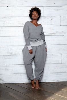 CLASSIC  SWEATSUIT - JIBRI     PANT Relaxed fit Exaggerated Hip Drape Side Pockets Inseam 32 High waist Invisible back zipper TOP Relaxed Fit V Neck with long sleeves Contrast ribbed finish Fabrication: French Terry Sizing: True to Size (View Size Chart) Handmade in Atlanta, GA Plus Size Lounge Wear Outfit, Plus Size Body Types, Sweat Suits Outfits, Sweatsuit Outfits, Grey Sweatsuit, Elegant Loungewear, Black Designers, Suits Outfits, Sweat Suits