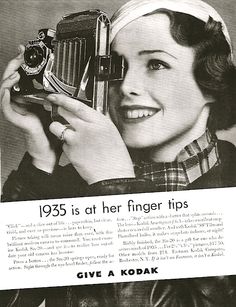 an advertisement for kodak's camera with a woman holding it