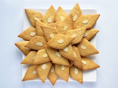 a white plate topped with cookies on top of a table