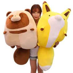 a woman holding two large stuffed animals