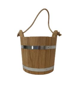 a wooden bucket with metal handles and rope on the handle is shown in front of a white background