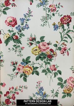 a floral wallpaper with many different colors and flowers on it's side,