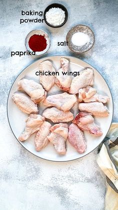 chicken wings on a plate with ingredients to make them