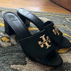 Tory Burch Everly 55mm Leather Heel Block Sandal Size 9 Black Open Toe Heels With Gold-tone Hardware, Black Heels With Gold-tone Hardware For Evening, Black Sandals With Gold-tone Hardware For Evening, Formal Black Sandals With Gold-tone Hardware, Elegant Black Sandals With Gold-tone Hardware, Luxury Tan Sandals For Formal Occasions, Elegant Tan Leather Sandals, Designer Tan Sandals For Formal Occasions, Elegant Black Heels With Gold-tone Hardware