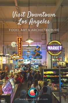 the inside of an art and architecture store with people walking through it in front of neon signs