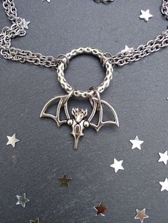 PLEASE read my shop announcement before placing an order so you know what to expect right now. Plus, when ordering from outside Europe, don't forget to provide a phone number for the courier to ensure the fastest and smoothest delivery. Witchy bat choker O ring necklace. Perfect for Samhain / Halloween, or your witchy everyday Short necklace, total length is 13 inches, about 43 cm. It fastens with a strong lobster clasp, and has a 2 inches, 5cm., extension chain. I can make this in your desired Silver Vampire Choker For Halloween, Fantasy Halloween Choker Necklace, Witchy Metal Jewelry For Halloween, Silver Vampire Style Choker Necklace, Vampire Style Choker Necklace For Halloween, Halloween Vampire Choker Necklace, Halloween Gothic Pendant Jewelry, Vampire Style Halloween Choker Necklace, Silver Witchy Choker Jewelry