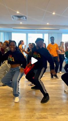 a group of young people dancing in a room