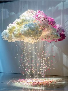 a cloud filled with flowers floating from the ceiling